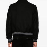 black  jacket warn a person,showing the jacket fit