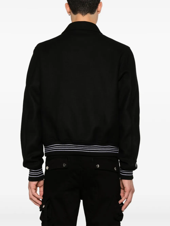 black  jacket warn a person,showing the jacket fit