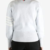 Gray cardigan worn by a person, showing the cardigan fit