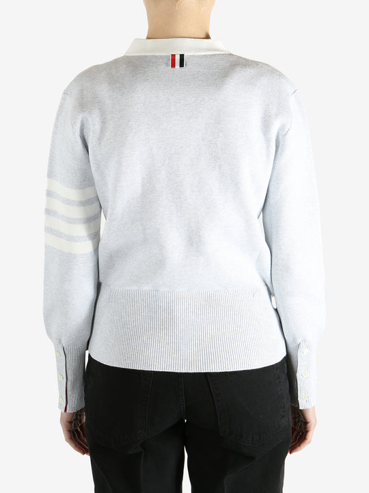 Gray cardigan worn by a person, showing the cardigan fit