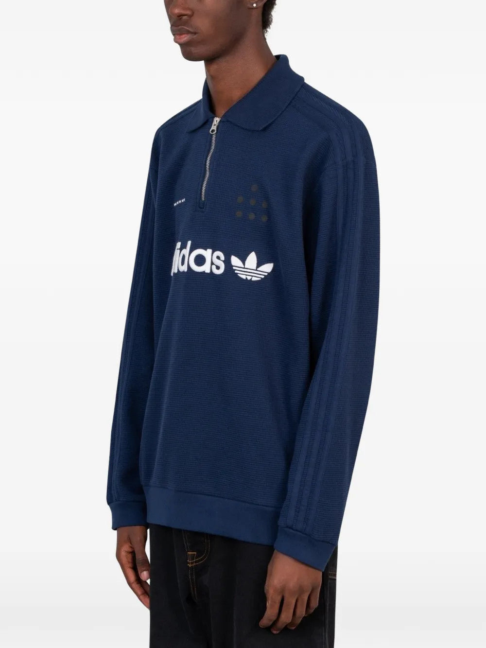 Navy shirt worn by a person, showing the shirt fit