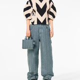 Blue bag worn by a person, showing the bag's fit