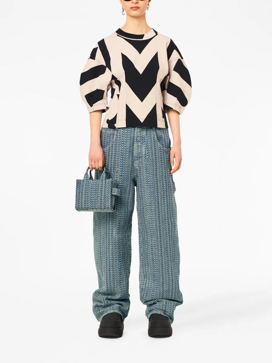 Blue bag worn by a person, showing the bag's fit