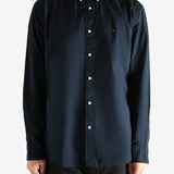 Navy shirt worn by a person, showing the shirt's fit