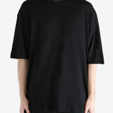 Black T-shirt worn by a person, showing the T-shirt fit