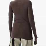 Brown long sleeves worn by a person, showing the T-shirt fit