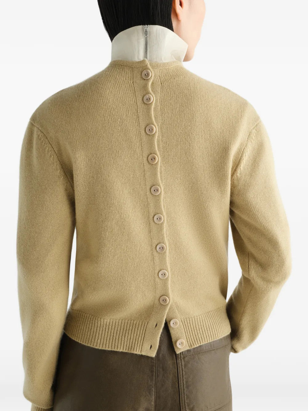 Tan hoodie worn by a person, showing the hoodie fit