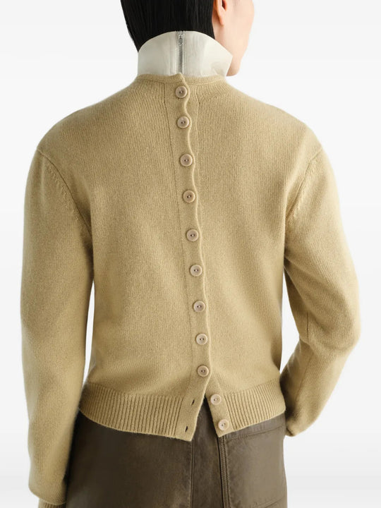 Tan hoodie worn by a person, showing the hoodie fit