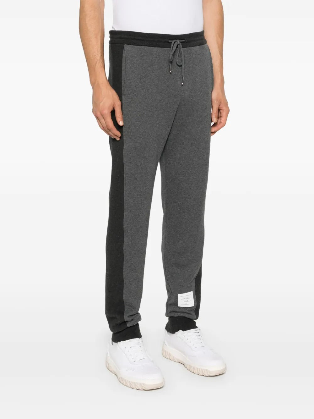 Grey pants worn by a person, showing the pants's fit