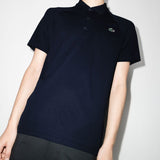 Navy shirts worn by a person, showing the shirts fit