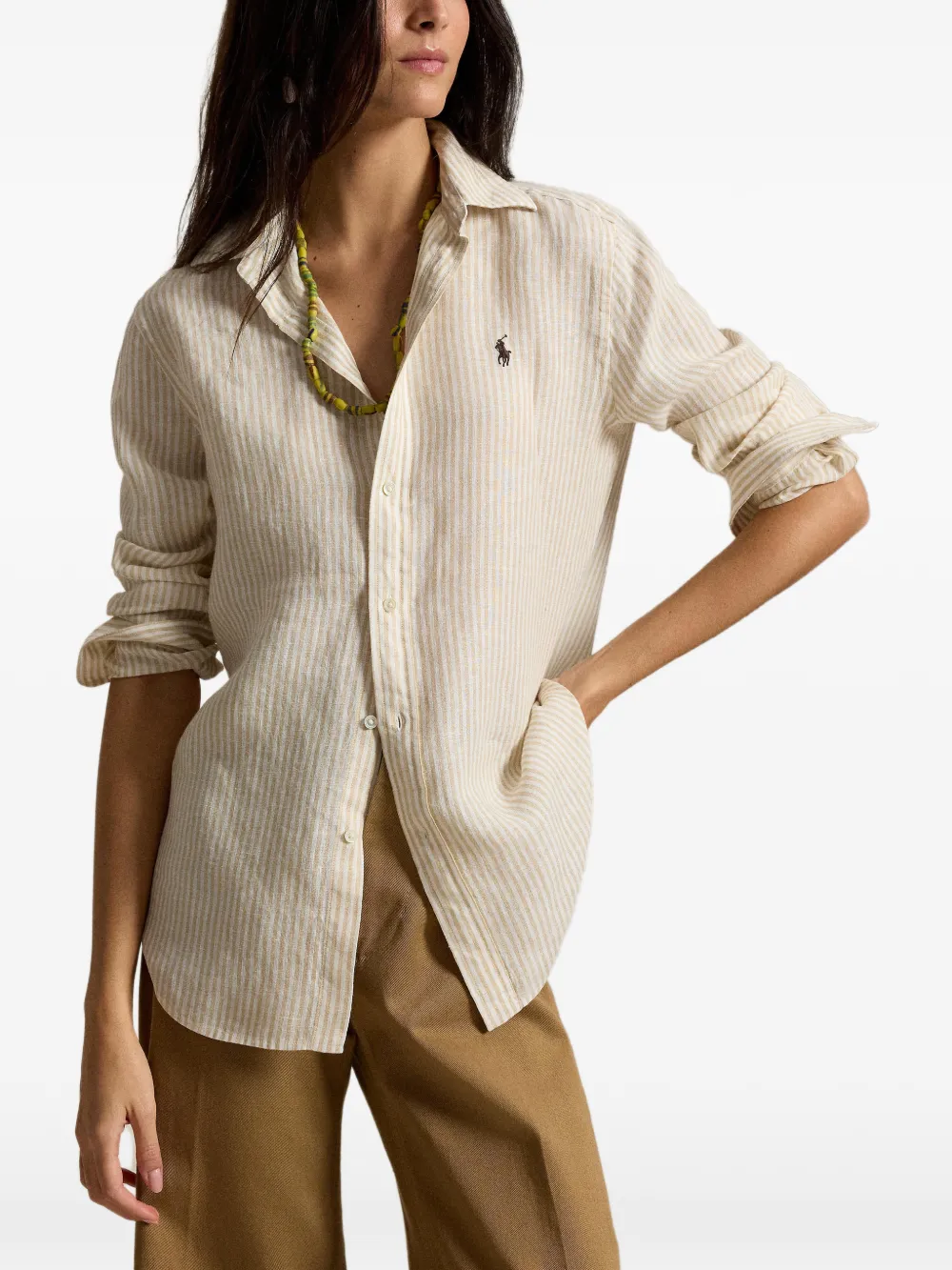 Tan knitwear worn by a person, showing the knitwear fit