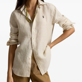 Tan knitwear worn by a person, showing the knitwear fit
