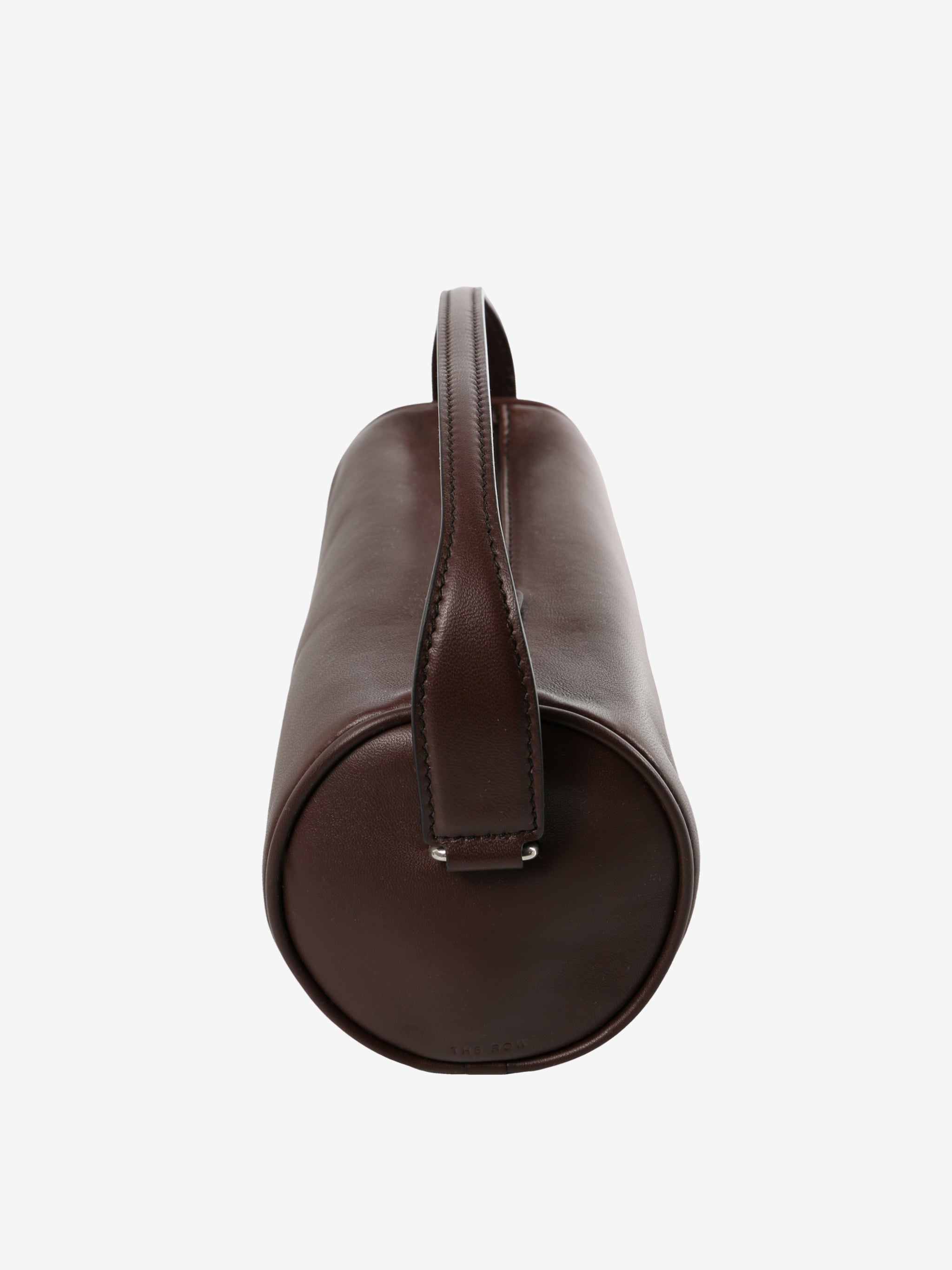 Close up of the brown bag, showing texture of the leather fabric