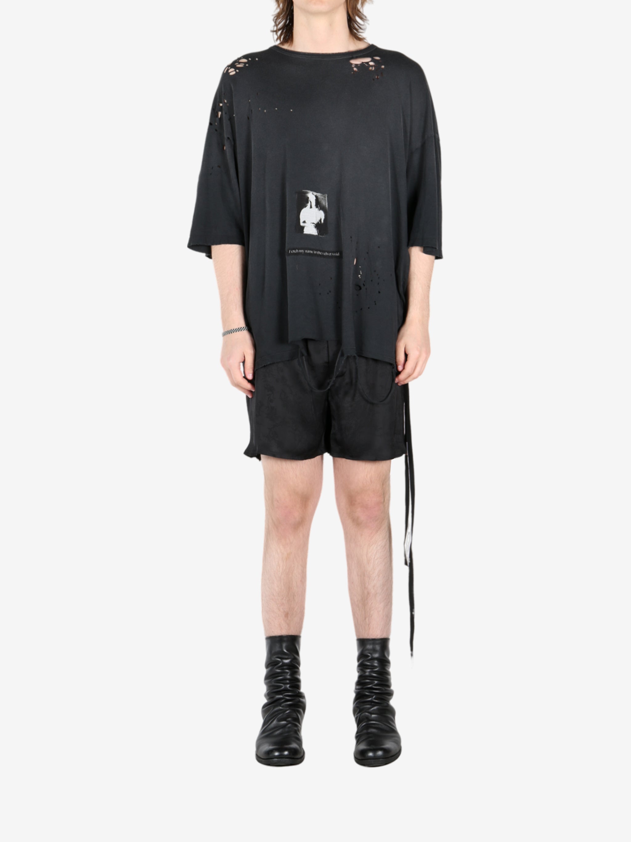 Black t-shirt, worn by a person, showing the t-shirt's fit