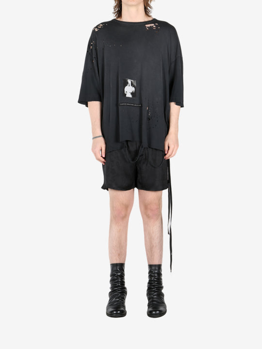 Black t-shirt, worn by a person, showing the t-shirt's fit