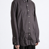 Purple shirt worn by a person, showing the shirt fit