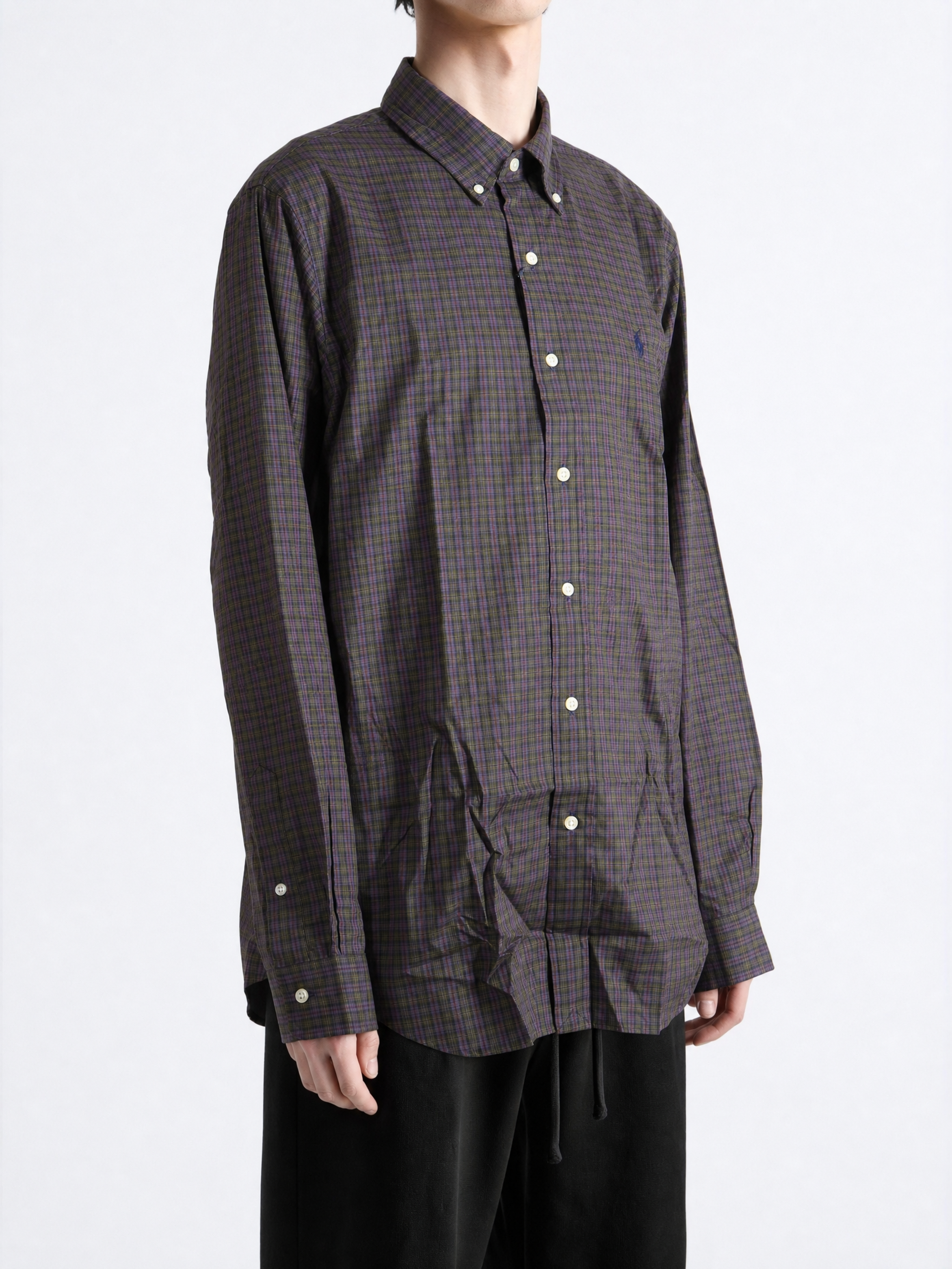 Purple shirt worn by a person, showing the shirt fit