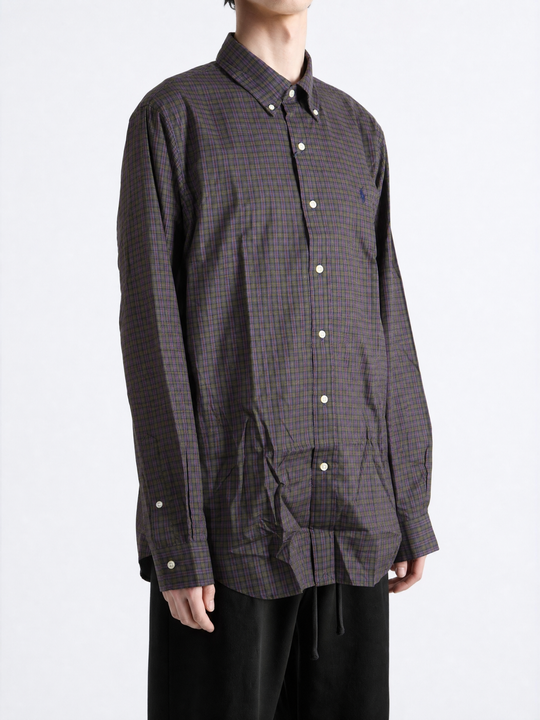 Purple shirt worn by a person, showing the shirt fit