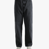 Black pant worn by a person, showing the pant's fit