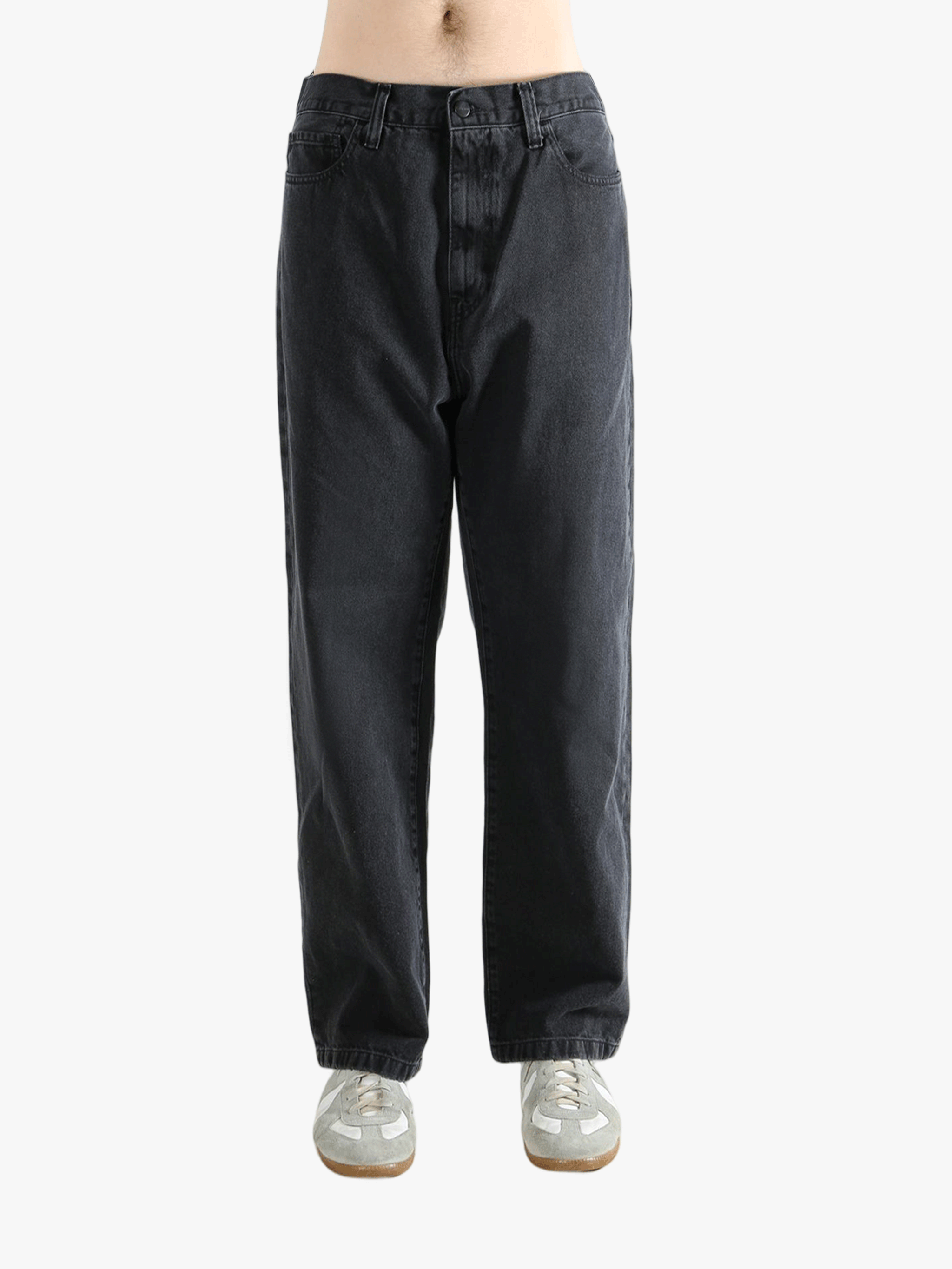 Black pant worn by a person, showing the pant's fit