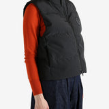 Black vest worn by a person, showing the vest's fit
