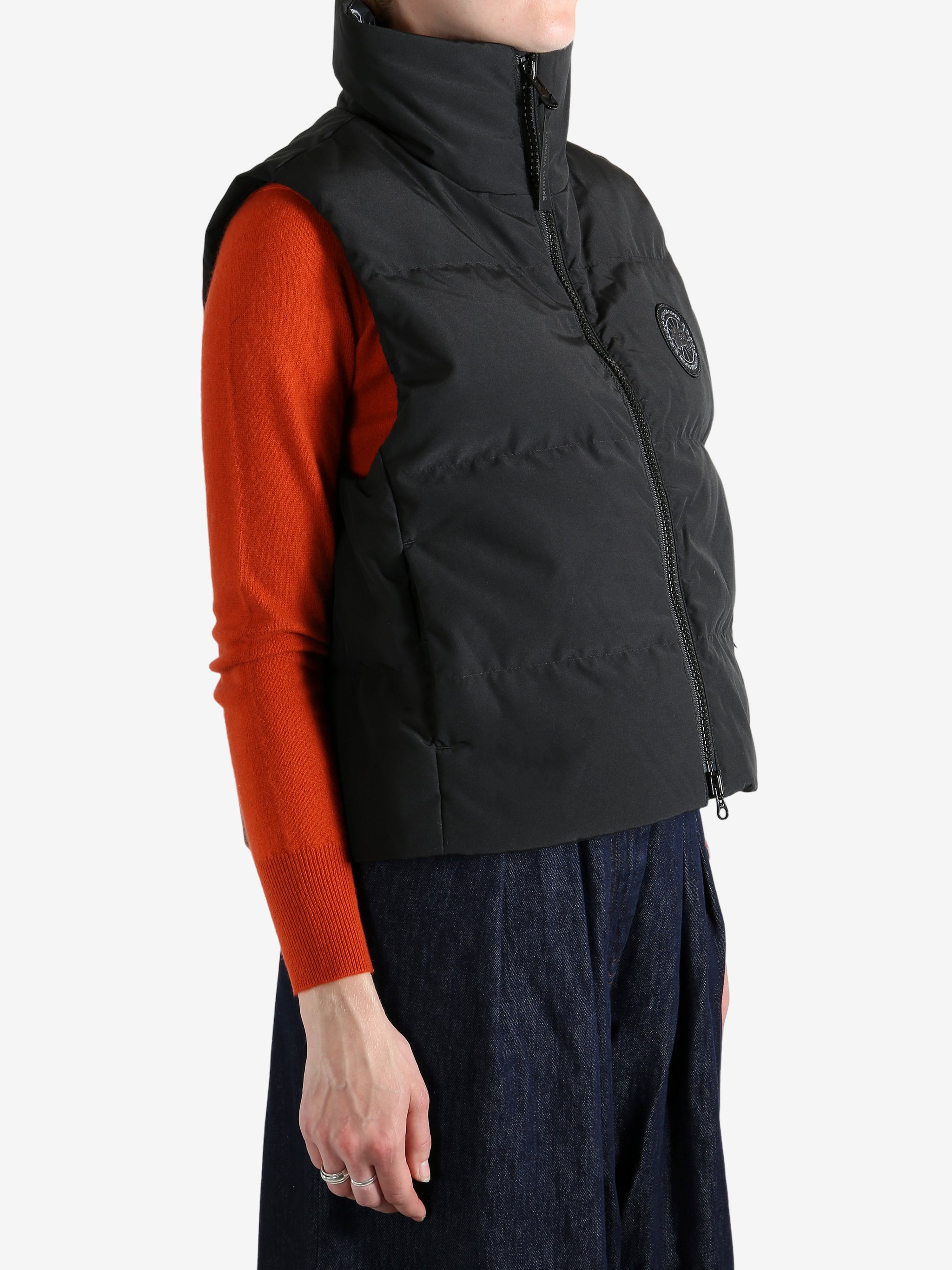 Black vest worn by a person, showing the vest's fit