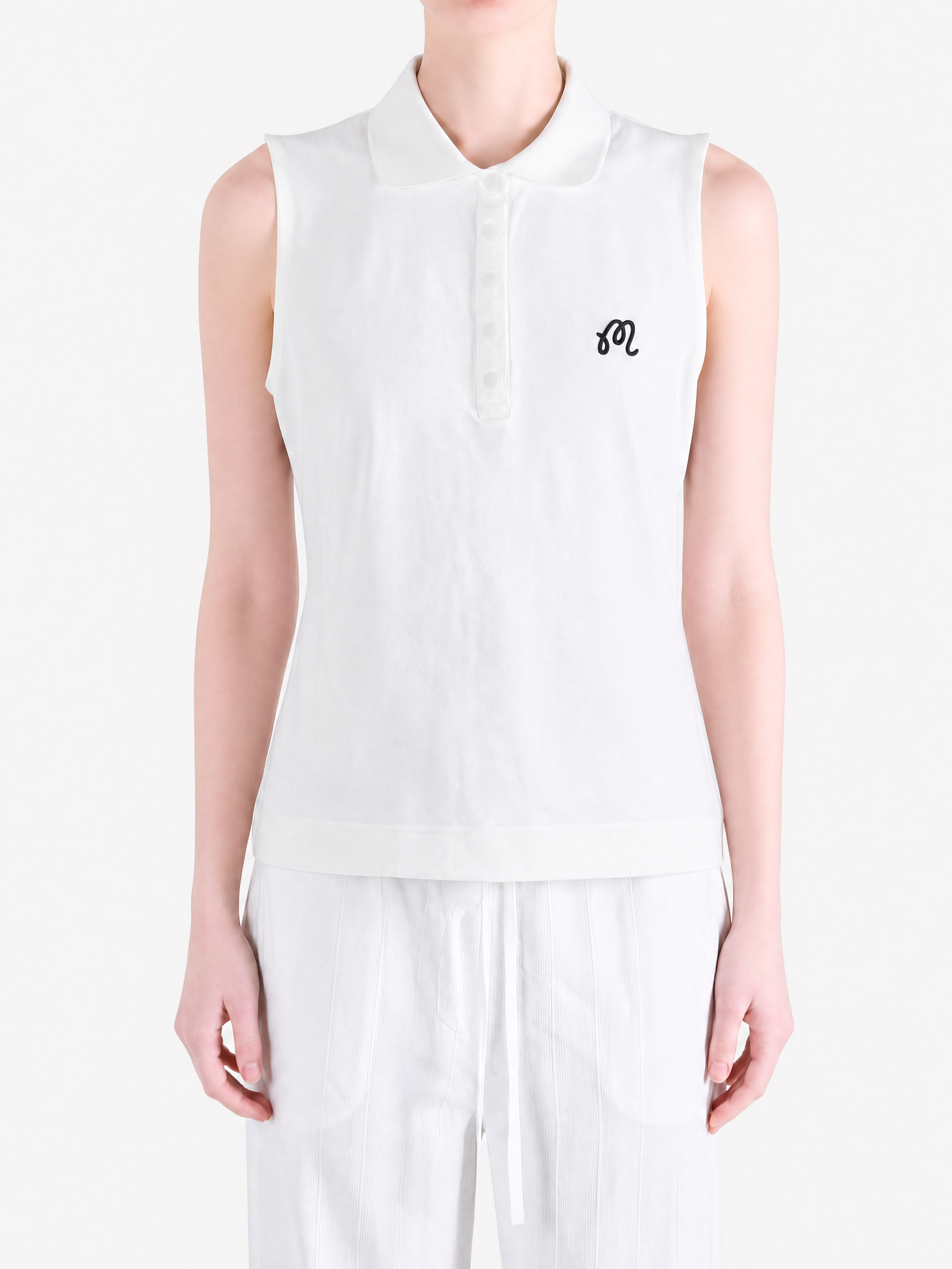 White top worn by a person, showing the top fit