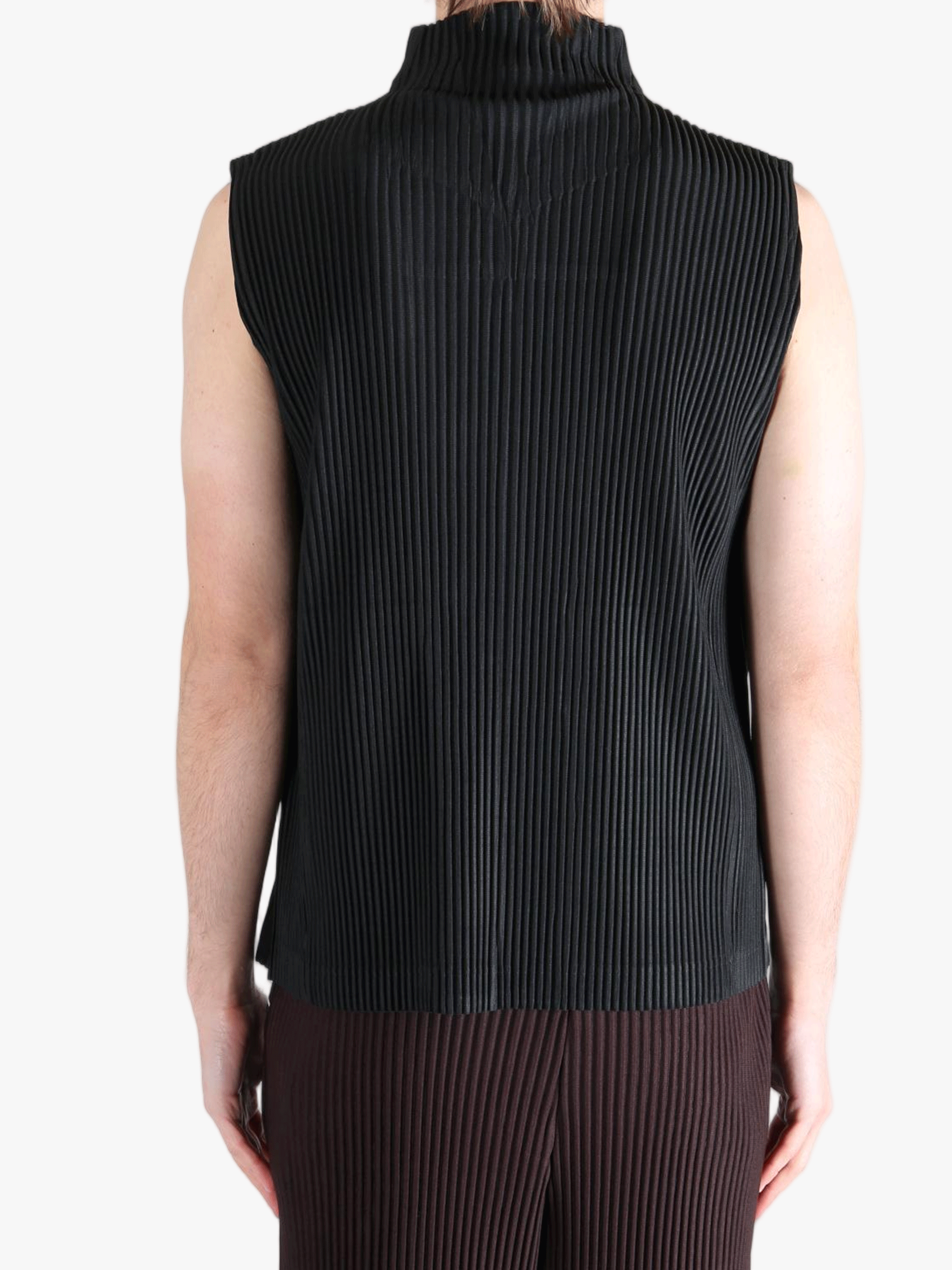 Black vest worn by a person, showing the vests fit