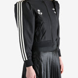 Black blouse worn by a person, showing the blouse's fit