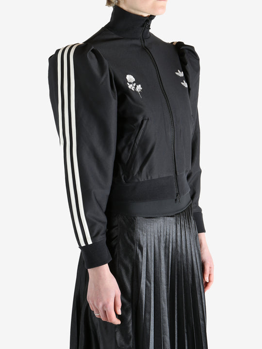 Black blouse worn by a person, showing the blouse's fit