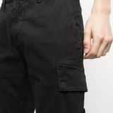 Close up of the black pants, showing texture of the organic cotton fabric