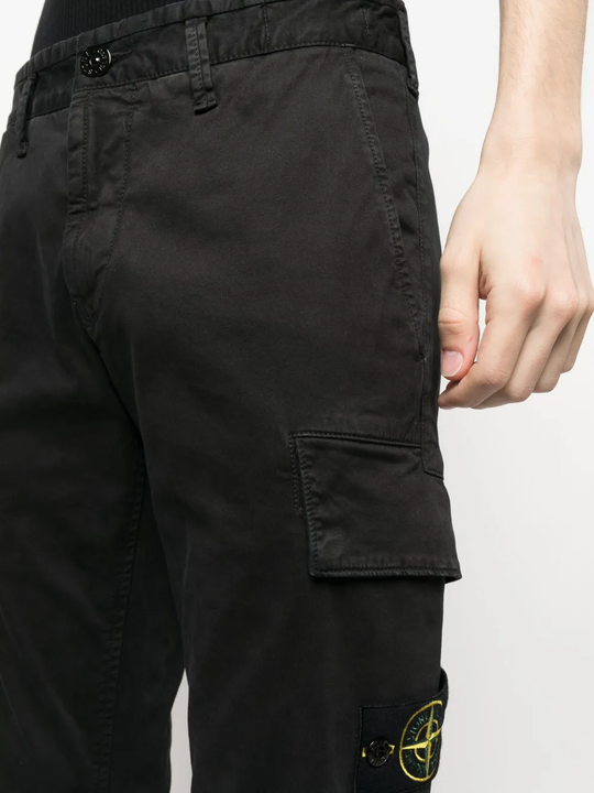 Close up of the black pants, showing texture of the organic cotton fabric