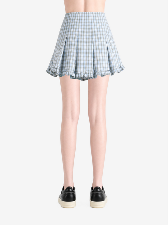 Blue skirt worn by a person, showing the skirt fit
