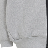 Close up of grey hoodies, showing texture of the organic cotton fabric