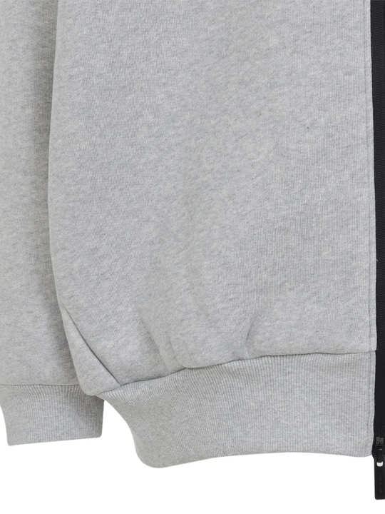 Close up of grey hoodies, showing texture of the organic cotton fabric