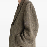 Close up of Tan coat, showing texture of the cotton fabric