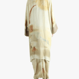 Tan top worn by a person, showing the top's fit