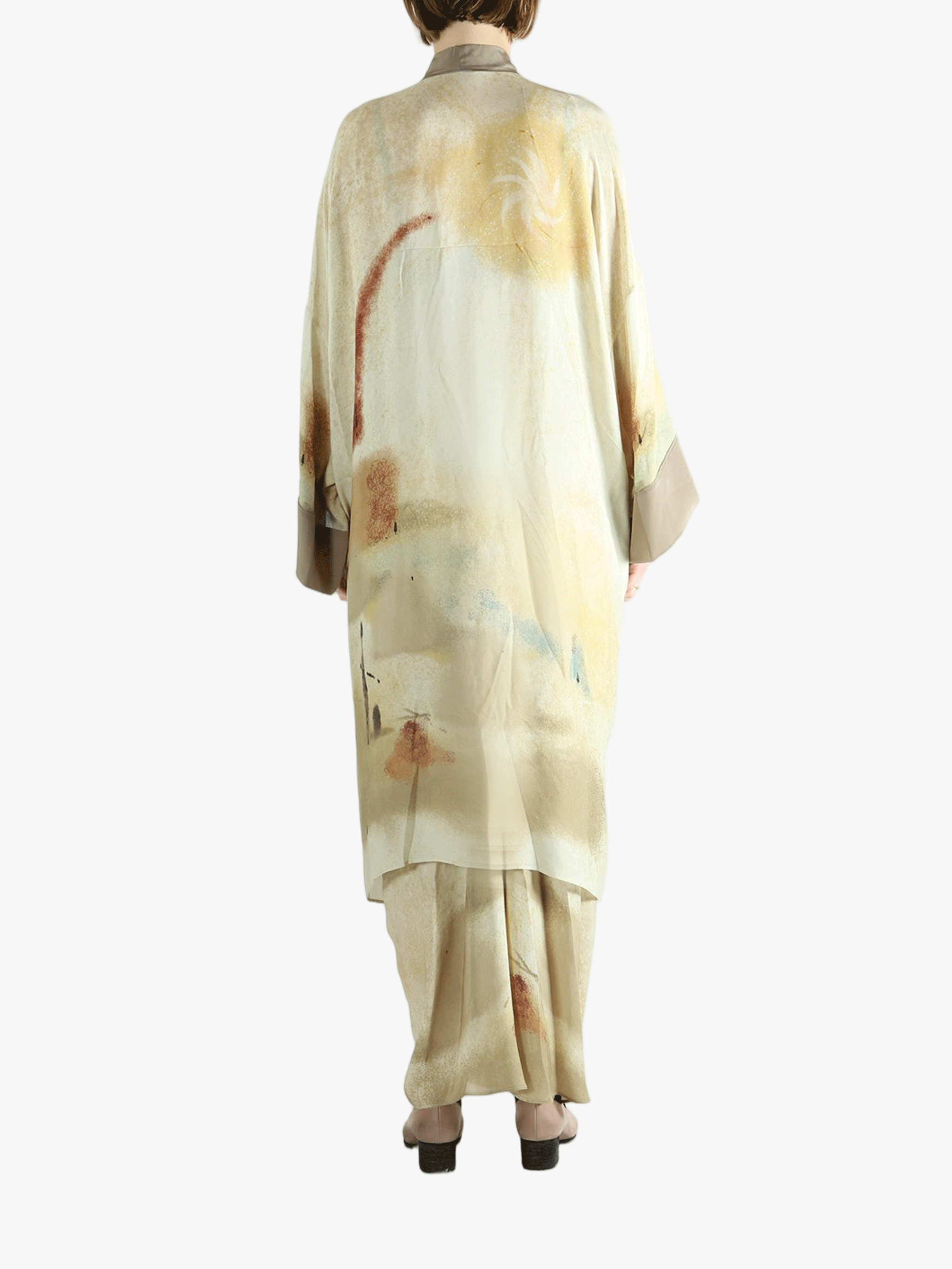 Tan top worn by a person, showing the top's fit