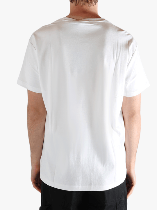 White t-shirts worn by a person, showing the t-shirts fit