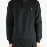 Black pullover worn by a person, showing the pullover's fit