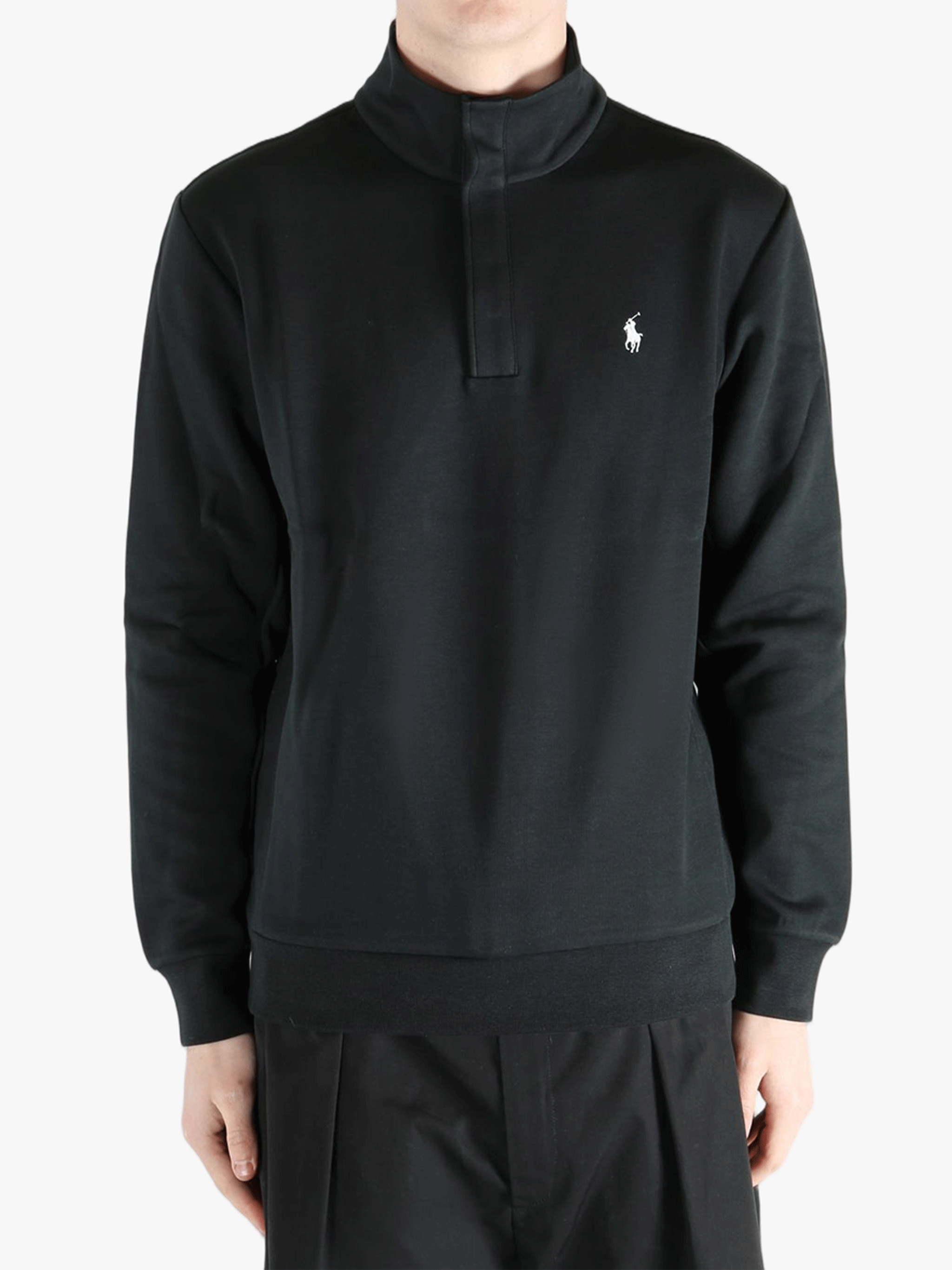 Black pullover worn by a person, showing the pullover's fit