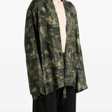Green jacket worn by a person, showing the jacket fit