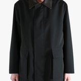 Black jacket worn by a person, showing the jackets fit