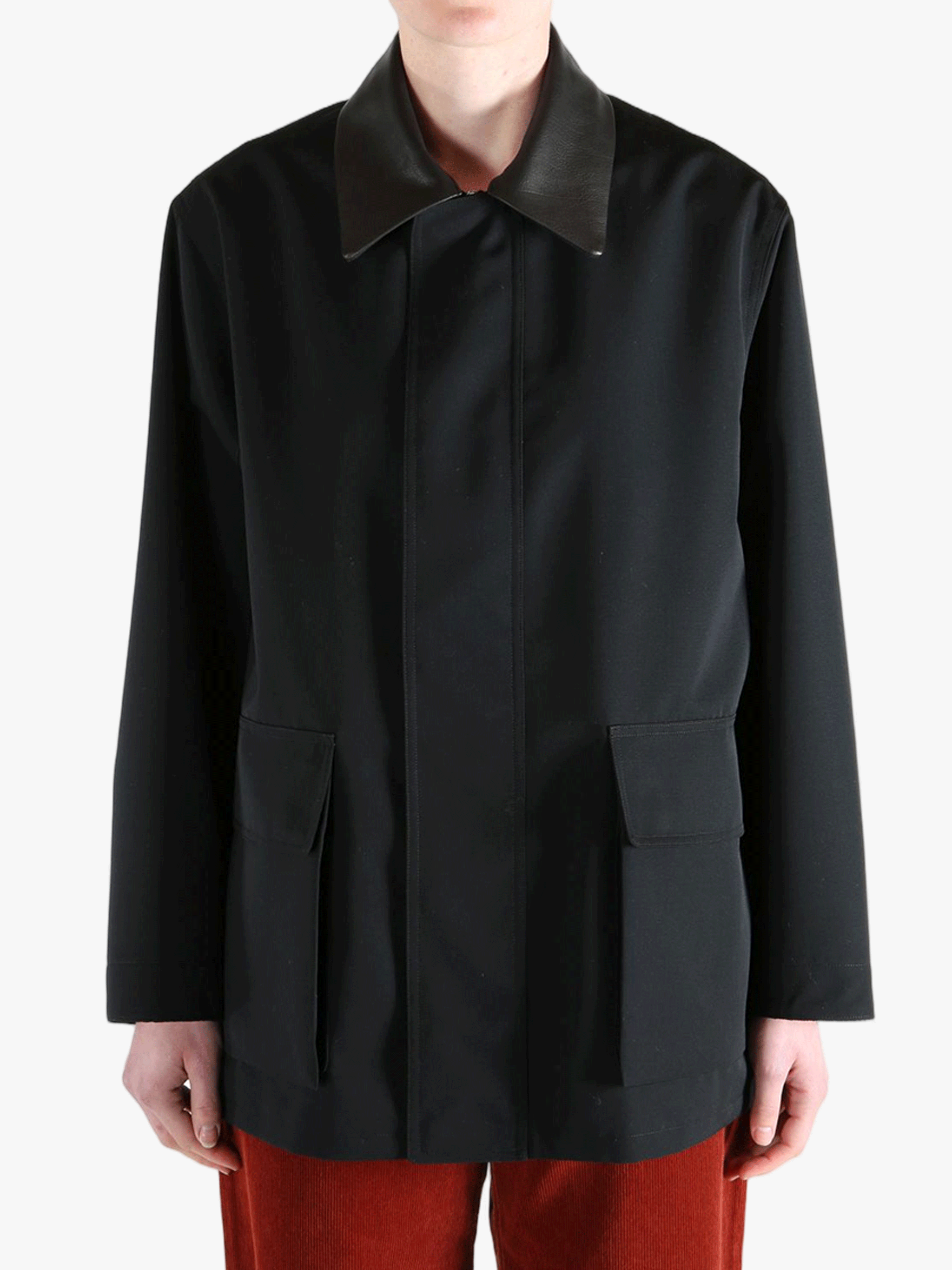 Black jacket worn by a person, showing the jackets fit