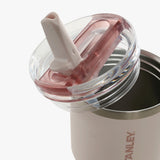 Close up of pink bottle, showing the detail of the lid and straw