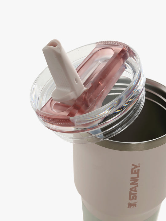 Close up of pink bottle, showing the detail of the lid and straw
