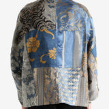 Blue jacket worn by a person, showing the jacket's fit