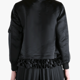 Black jacket worn by a person, showing the jacket's fit