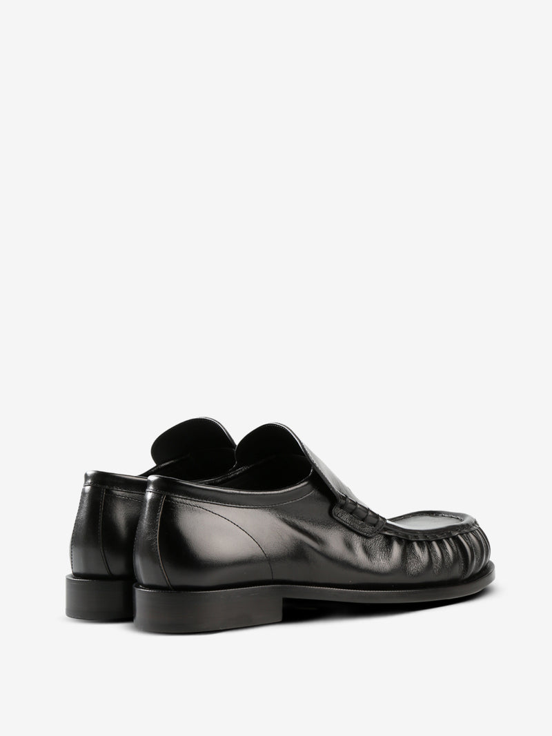 Black loafer, back view