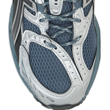 Close up of green sneakers, showing texture of the rubber fabric